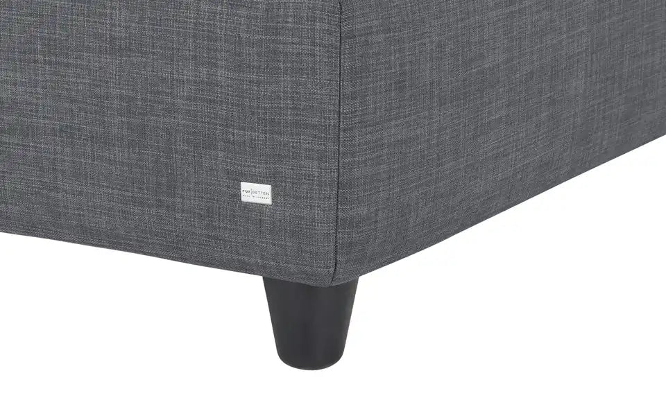 RUF Boxspringbett Verena Detailansicht Kopfteil – gepolstert, konisch schmale Füße Schwarz – RUF