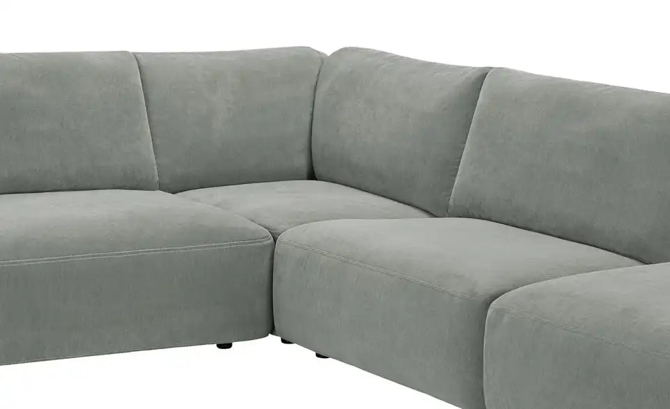 Musterring Ecksofa Lucia Nahaufnahme Fuß – schwarze Kunststoffgleiter – Musterring